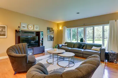 a living room with a couch and chairs and a tv at Warwick Vacation Rental with Private Yard and Fire Pit in Warwick