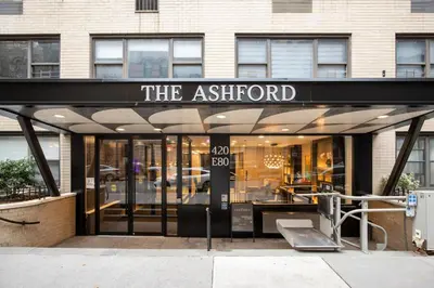 a store front with a sign that reads the ashford at UES 1br w elevator doorman nr Central Park NYC-1186 in New York