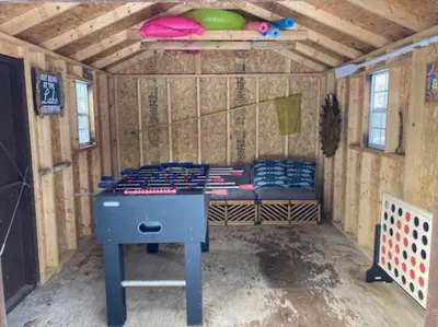 a room with a bed in a play house at Wally's Cabin in Hawley