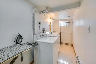 a white bathroom with a sink and a shower at East Hartford Studio about 4 Mi to Downtown Hartford! in East Hartford