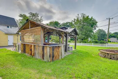 a wooden building in the grass in a yard at East Hartford Studio about 4 Mi to Downtown Hartford! in East Hartford
