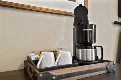 a coffee maker sitting on top of a table at Brook Bound Inn in Wilmington