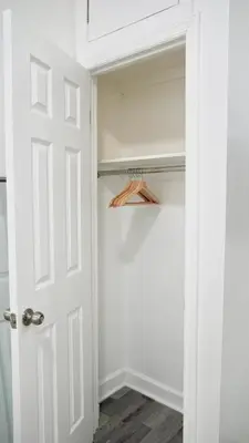 a closet with a white door and a hanger at Cozy Private studio in Bushwick in Brooklyn