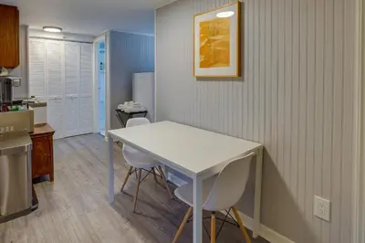 a kitchen with a white table and two chairs at Pet-Friendly Staatsburg Studio - Near State Park in Staatsburg