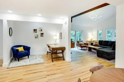 a living room with a couch and a table at Fully Remodeled Saugerties Retreat on 7 Acres! in Saugerties