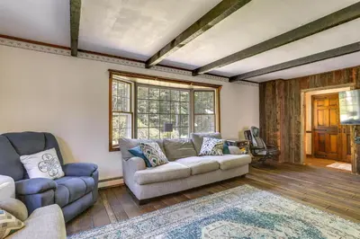 a living room with a couch and a chair at Sparrow Bush Retreat with Pool and Screened Porch in Sparrow Bush