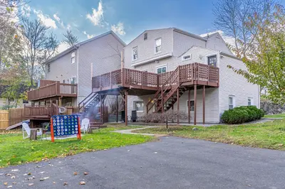a house with a deck on the side of it at H2 1 Bedroom Downtown Stamford in Stamford