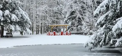 a group of people riding on a train in the snow at Mountain Blue Vista - Luxury retreat near Ski resorts with Pond, Firepit and Hot Tub in Windham
