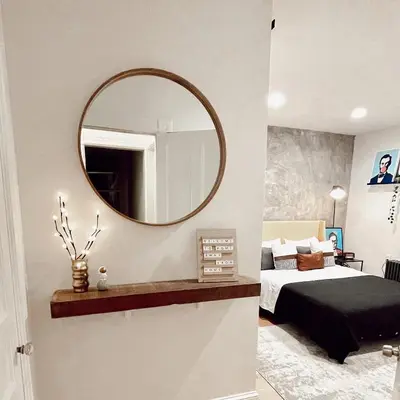 a bedroom with a bed and a mirror on the wall at Urban Bedroom in Mount Vernon