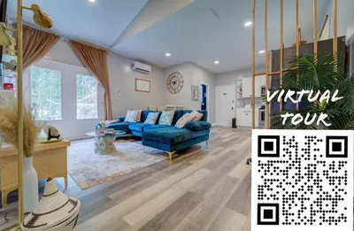 a living room with a blue couch in a room at The Little Villa - 2Bed 1Bath Private Suite in Bristol