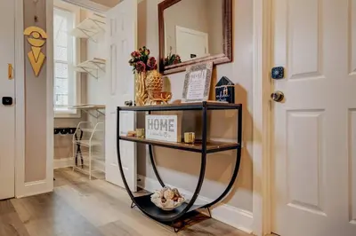 a shelf with a home sign on it in a hallway at The Little Villa - 2Bed 1Bath Private Suite in Bristol
