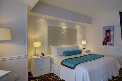 a bedroom with a bed with a large headboard at The Roslyn, Tapestry Collection by Hilton in Roslyn