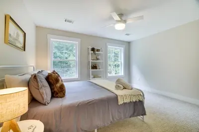 a bedroom with a bed and two windows at Cresco Countryside Oasis Surrounded by Nature! in Cresco
