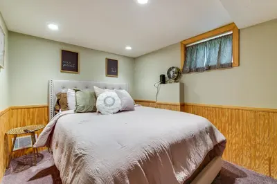 a bedroom with a bed and a window at 3 Mi to Dtwn Springfield Winter Retreat with Office in Springfield