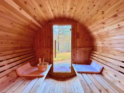 an inside of a wooden cabin with a window at Spring skiing with friends & family - Berkshires in Otis