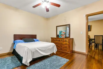 a bedroom with a bed and a ceiling fan at Bedroom near Yale Hospital/Bridgeport in Bridgeport