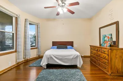 a bedroom with a bed and a ceiling fan at Bedroom near Yale Hospital/Bridgeport in Bridgeport