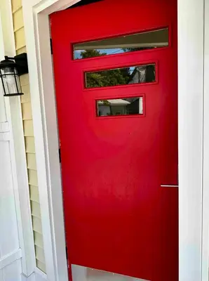 a red door with a window on a house at 3-A Diamond in Yonkers, NY in Yonkers