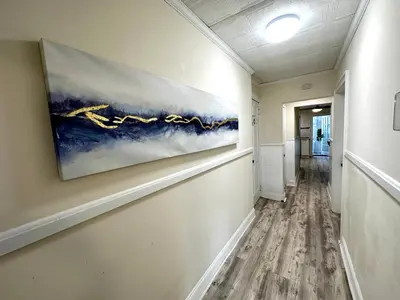 a hallway with a painting on the wall at 3-A Diamond in Yonkers, NY in Yonkers