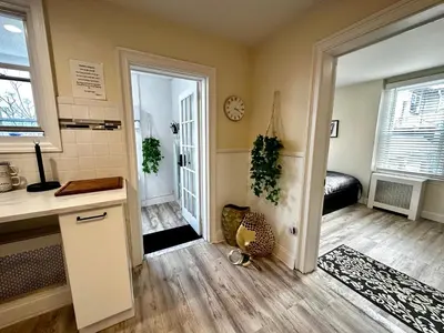 a room with a kitchen and a door to a bedroom at 3-A Diamond in Yonkers, NY in Yonkers