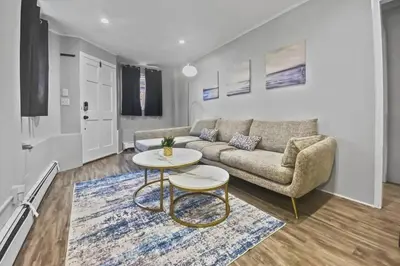 a living room with a couch and a table at Stylish & Cozy Perfect Hub for Stamford Escapades in Stamford
