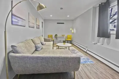 a living room with a couch and a table at Stylish & Cozy Perfect Hub for Stamford Escapades in Stamford