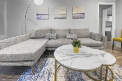 a living room with a couch and a table at Stylish & Cozy Perfect Hub for Stamford Escapades in Stamford