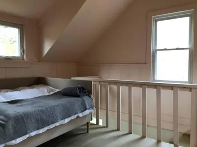 a bedroom with a bed and a window at Modern Cottage One (The Lorca, Catskills) in Shandaken