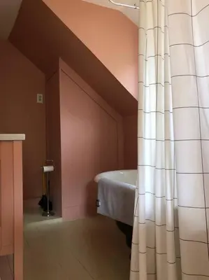 a bathroom with a bath tub in a room at Modern Cottage One (The Lorca, Catskills) in Shandaken
