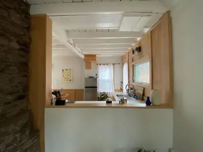 a kitchen with a sink and a counter top at Modern Cottage One (The Lorca, Catskills) in Shandaken