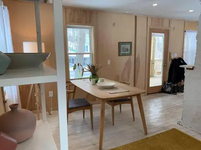 a kitchen with a table with a bowl on it at Modern Cottage Two (The Lorca, Catskills) in Shandaken