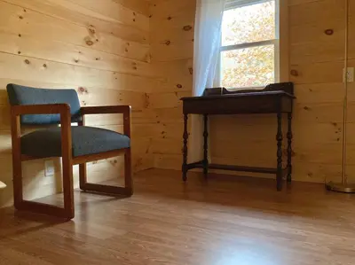 a room with a desk and a chair and a piano at Stream House (The Lorca, Catskills) in Shandaken
