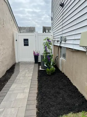 a walkway to a house with flowers on it at Silva Domus in West Orange