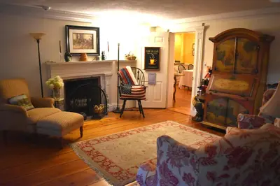 a living room with a couch and a fireplace at The Inn at Richmond in Richmond
