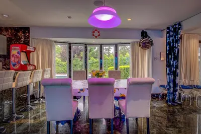 a dining room with a table and chairs at GABLES new 2024 in Bayside
