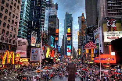 a crowd of people crossing a busy city street at SWJ 3rd - Sleeps 7,Close to LGA,Times Sq in 25 min in New York