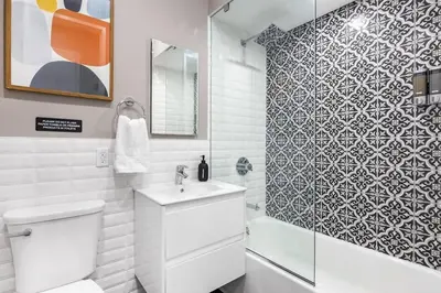 a bathroom with a toilet and a sink and a shower at SWJ 5th - Perfect for Tourism: Near Train, Times Sq, Dining in New York