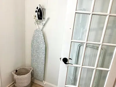 a tie hanging on a door next to a window at 8-A Diamond in Yonkers, NY in Yonkers
