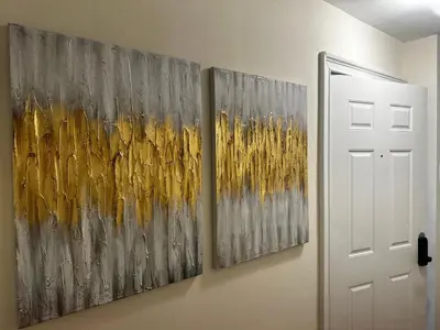 three paintings hanging on a wall next to a door at 10-A Diamond in Yonkers, NY in Yonkers