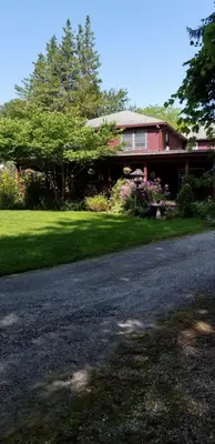a house with a road in front of it at Eastgate Inn B&B in Lenox