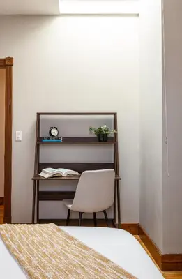 a bedroom with a desk and a chair at Downtown New Haven, Spacious Stay by Yale - AO Destinations in New Haven