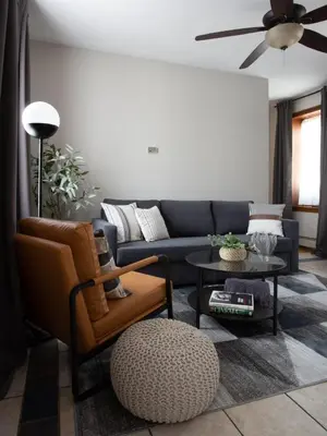a living room with a couch and a table at Downtown New Haven, Spacious Stay by Yale - AO Destinations in New Haven