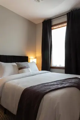 a bedroom with two beds and a window at Downtown New Haven, Spacious Stay by Yale - AO Destinations in New Haven