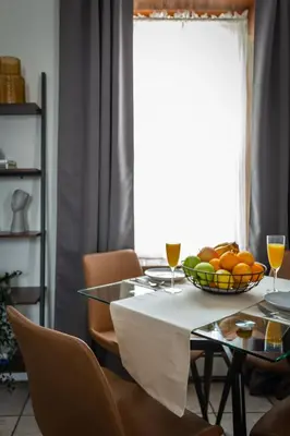 a dining room table with a bowl of fruit on it at Downtown New Haven, Spacious Stay by Yale - AO Destinations in New Haven