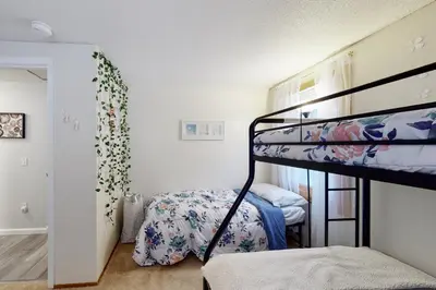 a bedroom with a bunk bed and a bedroom with a bunk bed at Gone Ski inn in West Dover