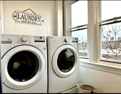 a laundry room with a washing machine and a window at 0-A Diamond in Yonkers, NY in Yonkers