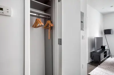 a room with a door open to a closet at Gorgeous Midtown W 1BR w Gym nr Times Sq NYC-651 in New York