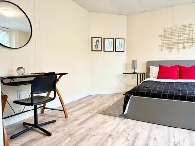 a bedroom with a bed and a desk and a chair at 1-A Diamond in Yonkers, NY in Yonkers