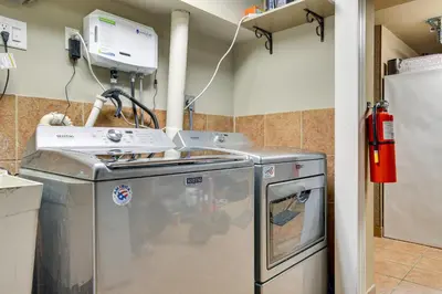 a kitchen with a stove and a refrigerator at New Fairfield Vacation Rental with Lake Views! in New Fairfield