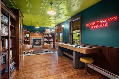 a game room with a ping pong table at Hotel Mountain Brook in Tannersville